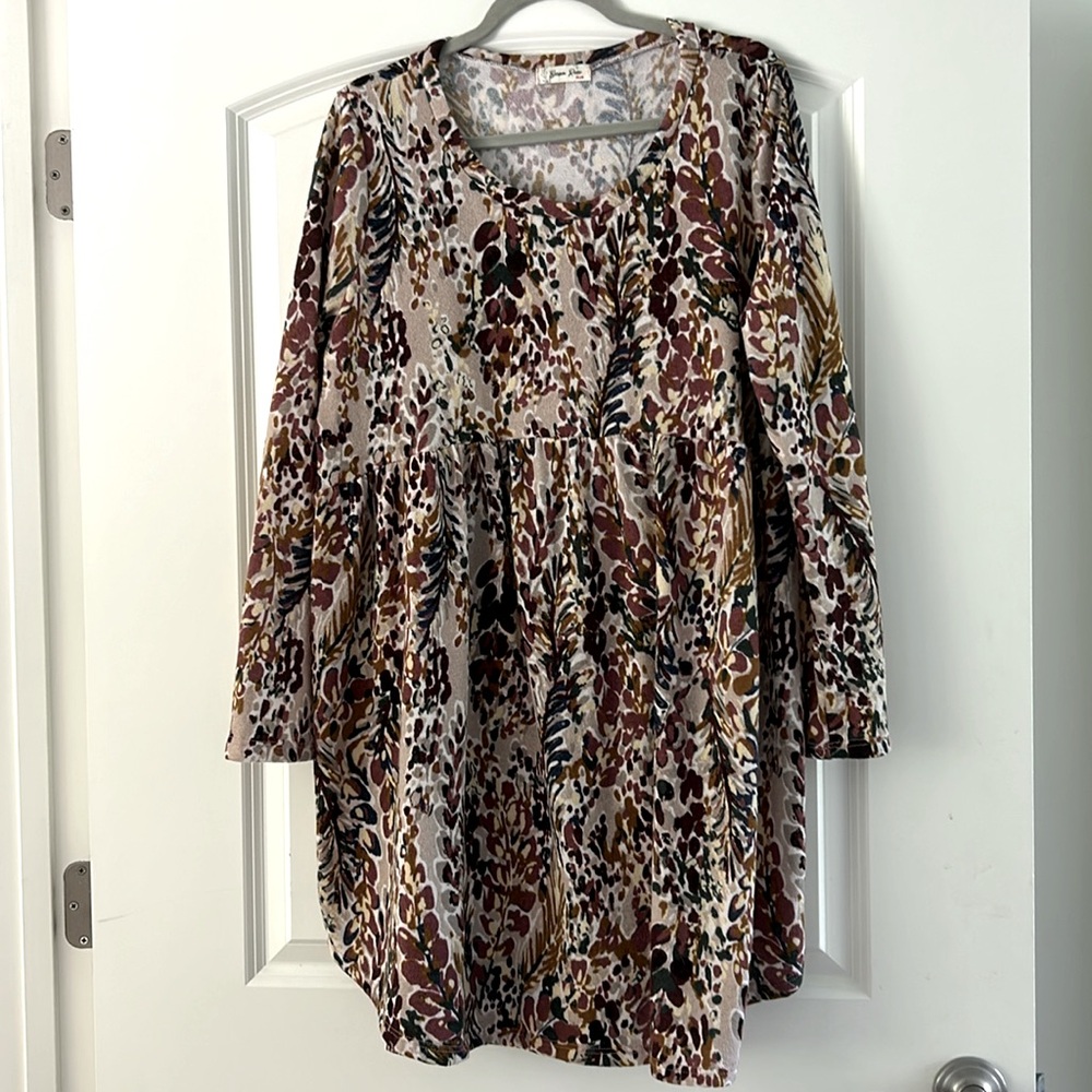 Colorful, floral, long-sleeved dress with a soft fabric and flattering skirt